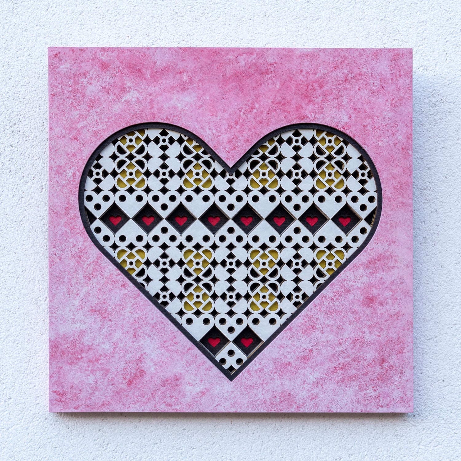 original heart shaped symmetrical artwork with custom pink based paint effect.