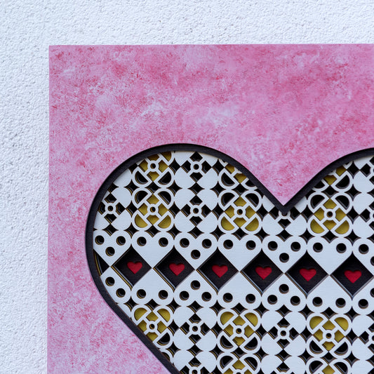 original heart shaped symmetrical artwork with custom pink based paint effect.