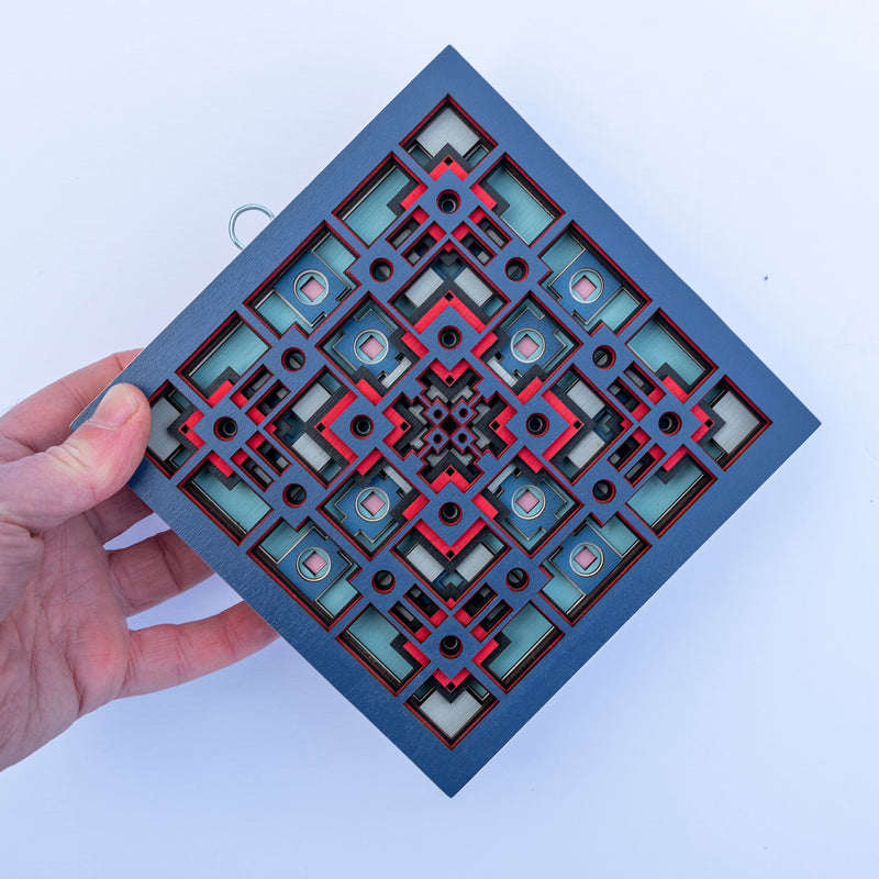 Noughts and crosses. An original multi layered mandala artwork designed using geometric and symmetrical patterns. Unique statement wall décor.