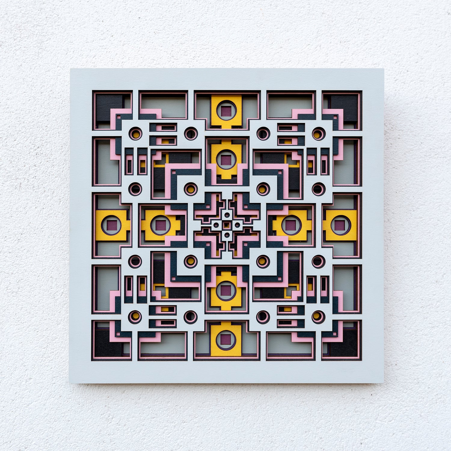 Noughts and crosses. An original multi layered artwork designed using geometric and symmetrical patterns. Unique statement wall décor.