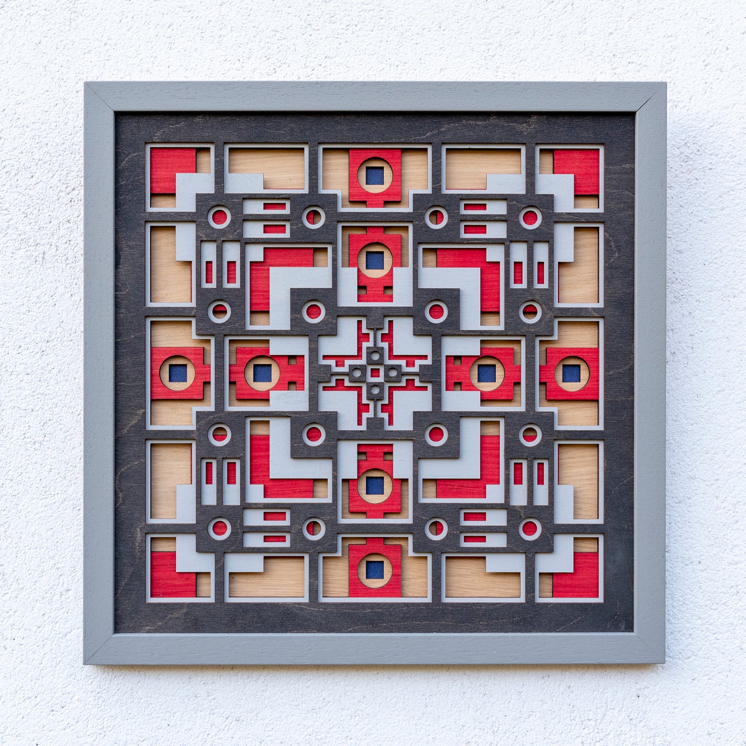 Noughts and crosses. A layered plywood artwork designed using geometric and symmetrical patterns. visually balanced wall art.