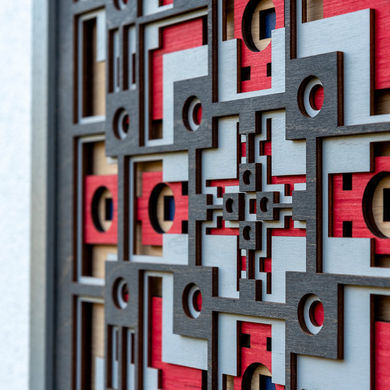Noughts and crosses. A layered plywood artwork designed using geometric and symmetrical patterns. visually balanced wall art.
