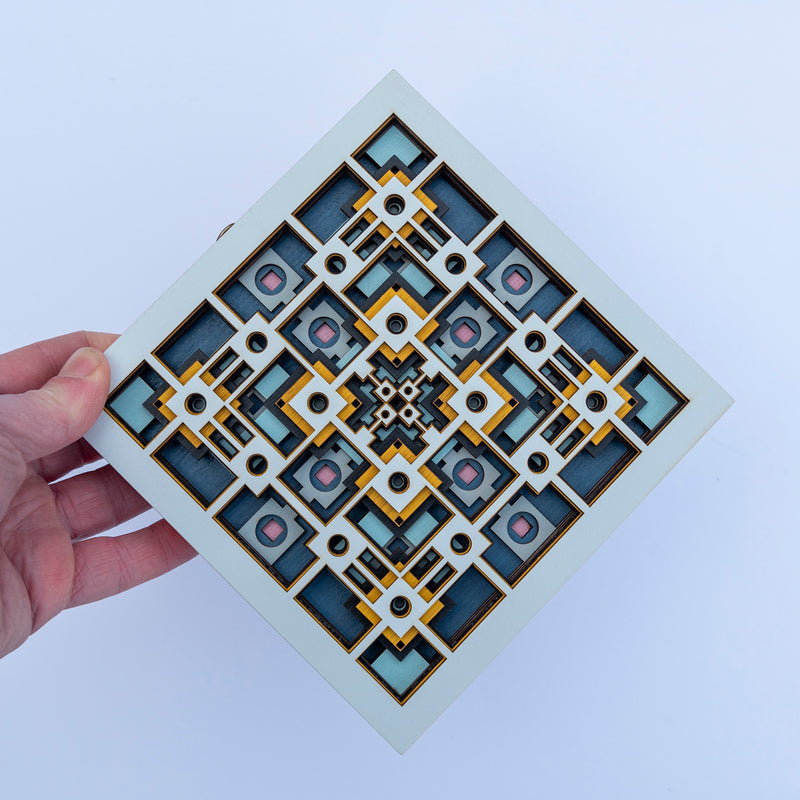Noughts and crosses. An original multi layered mandala artwork designed using geometric and symmetrical patterns. Unique statement wall décor.