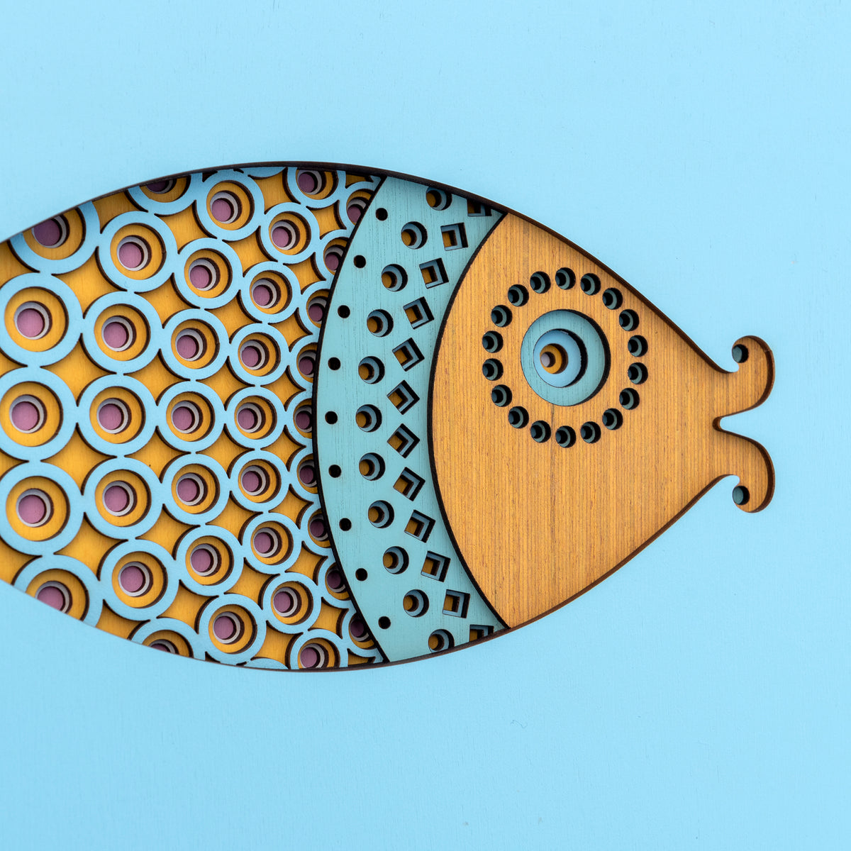 An original Fish themed multi layered artwork designed using geometric patterns. Beautiful, quirky unique wall décor.